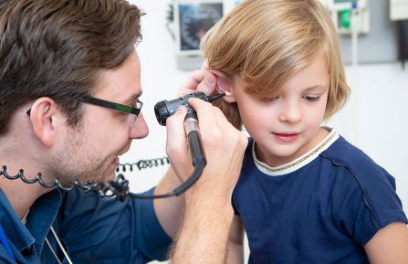 Sam Ogden, MD, examines a patient